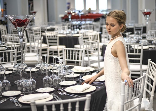 How can a CMMS assist in tracking maintenance expenses in catering operations?