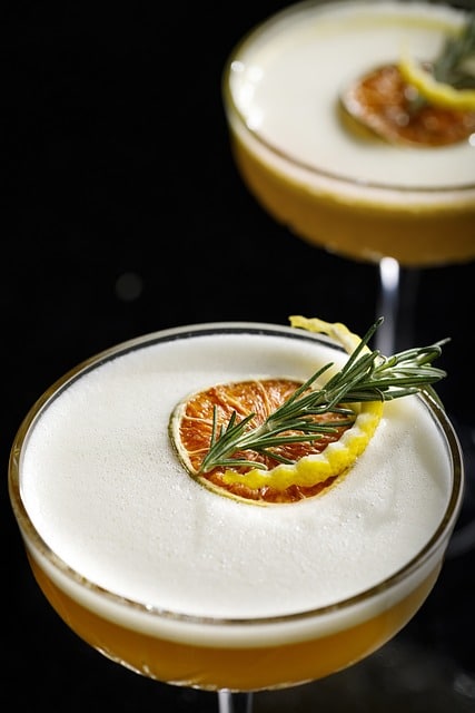 How can a CMMS improve the scheduling of maintenance tasks in beverage production?