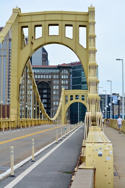 How does a CMMS enhance infrastructure management in telecommunications?