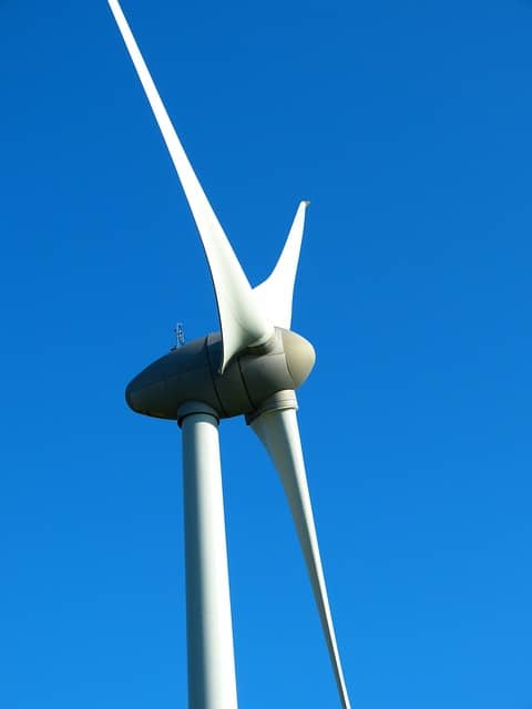 How does a CMMS help in managing energy consumption in automotive plants?