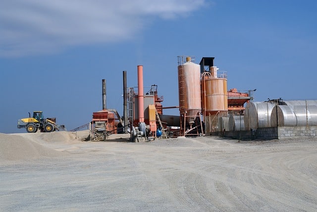 How does a CMMS support the maintenance of heavy machinery in construction?